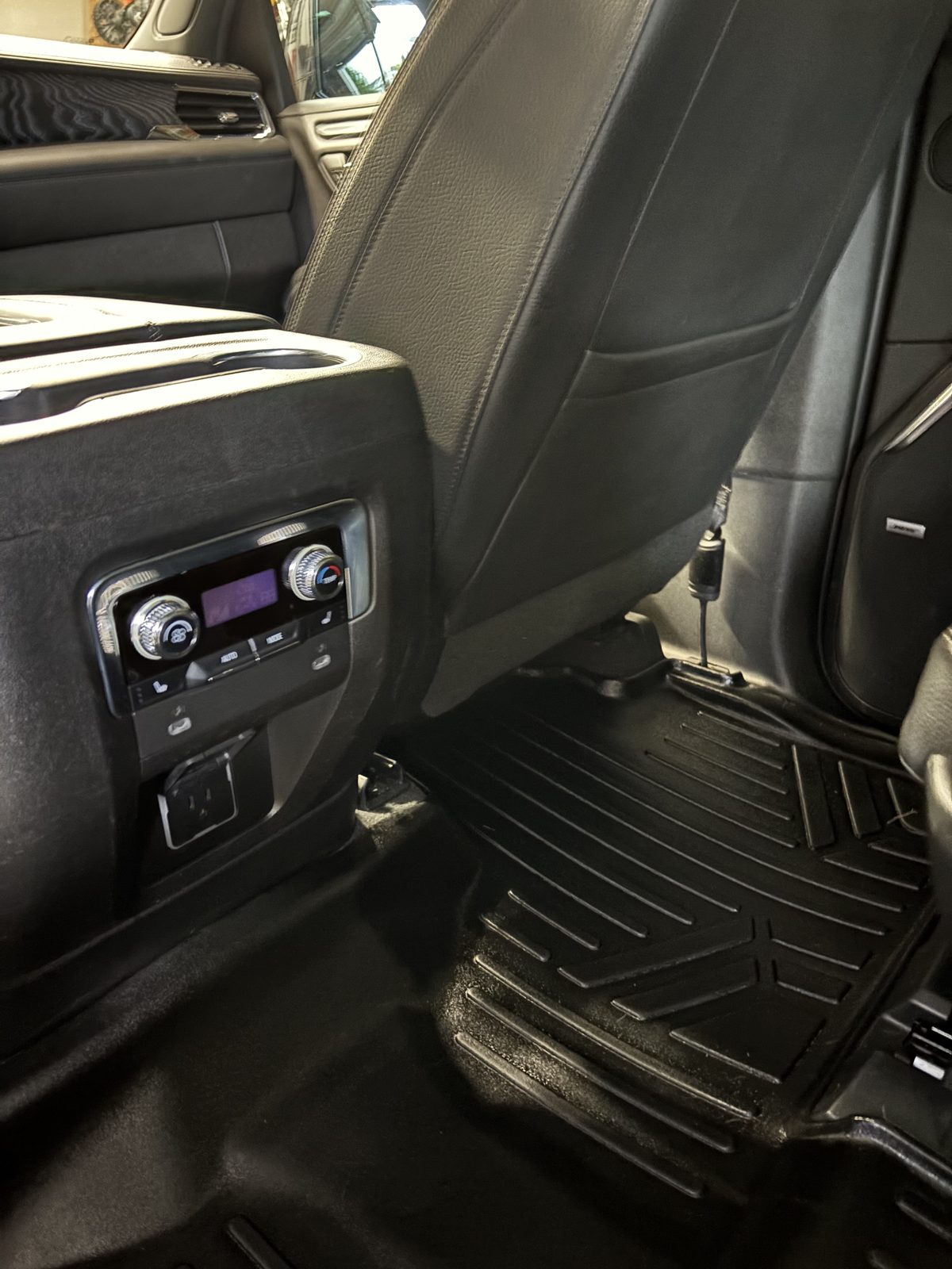 Cleaned rubber floor mats and door sill of a truck